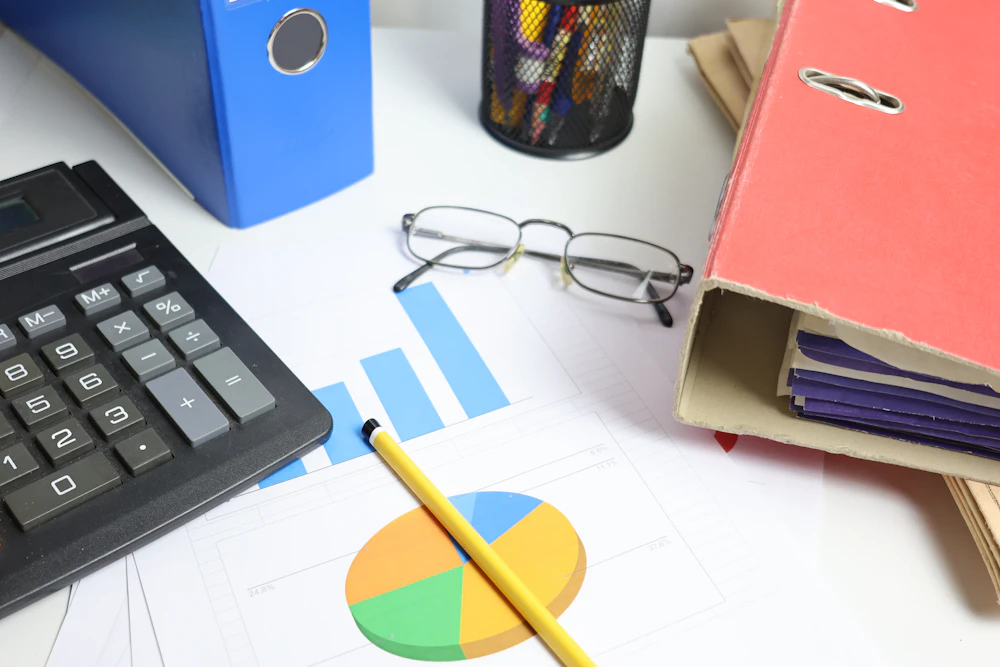 A tidy service desk with organized binders and documents